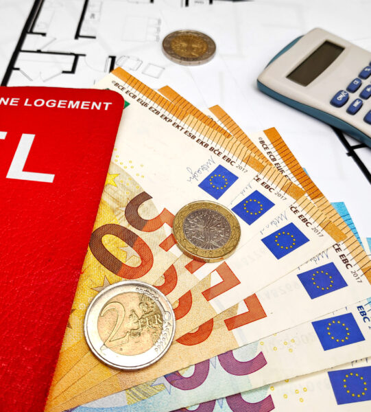 CEL filled with euro banknotes atop of a stack of blueprints. The Compte Epargne Logement (CEL) is a housing savings plan (CEL) offered by French banks.