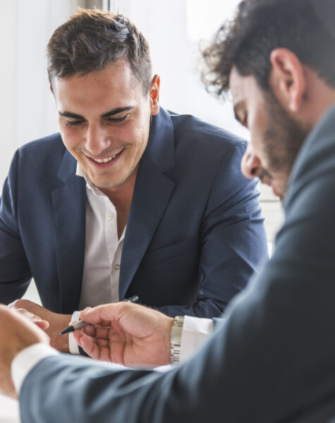 portrait-smiling-businessman-sitting-with-his-partner