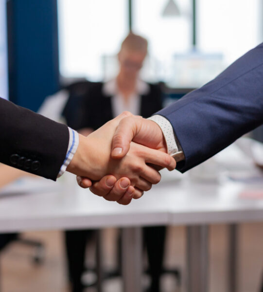 Satisfied businessman company employer wearing suit handshake new employee get hired at job interview, Man hr manager employ successful candidate shake hand at business meeting, placement concept